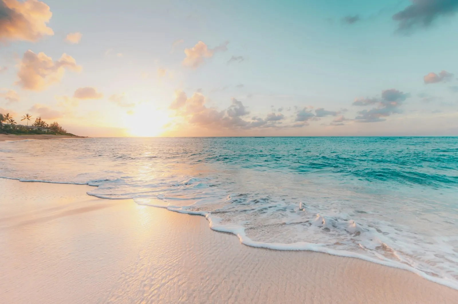 Turquoise-water beach at sunset
